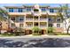 Beautiful multi-story condo building with balconies and lush landscaping at 913 Lotus Vista Dr # 101, Altamonte Springs, FL 32714