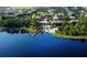 Aerial view of community by the lake with pool and dock at 113 Rogues Retreat, Davenport, FL 33897