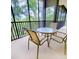 Private balcony with table and chairs at 113 Rogues Retreat, Davenport, FL 33897