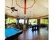 Community bar area with pool table and seating at 113 Rogues Retreat, Davenport, FL 33897