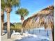 Beach area with lounge chairs and lake access at 113 Rogues Retreat, Davenport, FL 33897