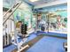 Fitness center with weight machines and free weights at 113 Rogues Retreat, Davenport, FL 33897