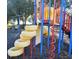 playground with climbing structures and tire swing at 113 Rogues Retreat, Davenport, FL 33897