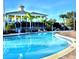 Resort-style pool with spacious deck and clubhouse at 113 Rogues Retreat, Davenport, FL 33897