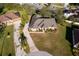 Aerial view of single-Gathering home with driveway and landscaped yard at 13707 Calle De Ora Ct, Clermont, FL 34711