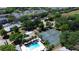Community aerial view of tennis court, pool, parking lot and housing at 2722 Graduate Ct, Orlando, FL 32826