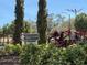 Chancellors Row community sign surrounded by lush landscaping and tall trees on a bright day at 2722 Graduate Ct, Orlando, FL 32826