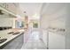 Clean kitchen featuring a double sink, ample cabinets, and a laundry area at 2722 Graduate Ct, Orlando, FL 32826