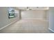 Bright, spacious living room featuring tile flooring, a ceiling fan, and a large window at 2722 Graduate Ct, Orlando, FL 32826