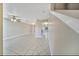 Bright, spacious living room featuring tile flooring and view to kitchen and stairs at 2722 Graduate Ct, Orlando, FL 32826