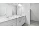 Modern bathroom featuring double vanity and walk-in shower at 349 River Front Way, Edgewater, FL 32141