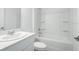 Contemporary bathroom featuring a bathtub/shower combo, toilet and a vanity at 349 River Front Way, Edgewater, FL 32141