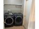 Well-equipped laundry room featuring front-loading washer and dryer at 806 Grantham Dr, Kissimmee, FL 34758