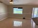 Living room with tile floors, ceiling fan and window for natural light at 806 Grantham Dr, Kissimmee, FL 34758