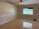 Inviting living room features tile floors, a ceiling fan, and a window for natural light at 806 Grantham Dr, Kissimmee, FL 34758