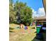 Backyard with playground set and fire pit at 4490 Treasure Cay Rd, Tavares, FL 32778