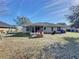 Spacious backyard with screened patio at 4490 Treasure Cay Rd, Tavares, FL 32778