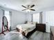 Spacious bedroom with large closet and ceiling fan at 4490 Treasure Cay Rd, Tavares, FL 32778