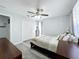 Bright bedroom with ceiling fan and walk in closet at 4490 Treasure Cay Rd, Tavares, FL 32778