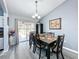 Bright dining room with sliding glass doors to backyard at 4490 Treasure Cay Rd, Tavares, FL 32778