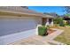 White garage door with a well-maintained surrounding area at 4490 Treasure Cay Rd, Tavares, FL 32778