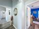 Bright hallway with decorative mirror and vase at 4490 Treasure Cay Rd, Tavares, FL 32778