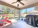 Relaxing screened patio, perfect for outdoor enjoyment at 4490 Treasure Cay Rd, Tavares, FL 32778