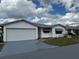 Well-maintained single-story home with an attached garage, tidy landscaping, and inviting curb appeal at 4901 Pleasant Hollow Trl, Lakeland, FL 33811