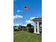 Community grounds featuring an American flag, gazebo, and lush landscaping, perfect for outdoor enjoyment at 4901 Pleasant Hollow Trl, Lakeland, FL 33811