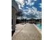 Community pool with clear blue water, lounge chairs, gazebo and brick pavers at 4901 Pleasant Hollow Trl, Lakeland, FL 33811