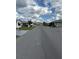 Wide street showcasing various well-kept single-story homes and established landscaping for a friendly neighborhood feel at 4901 Pleasant Hollow Trl, Lakeland, FL 33811