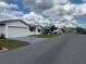 Charming single-story homes line a peaceful street with well-manicured lawns and inviting curb appeal at 4901 Pleasant Hollow Trl, Lakeland, FL 33811
