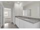 Clean bathroom with double vanity and granite top at 957 King Parc Rd, Orange City, FL 32763