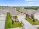 A beautiful home featuring a well-manicured lawn and an attached two-car garage at 957 King Parc Rd, Orange City, FL 32763