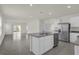 Modern kitchen with island and stainless steel appliances at 957 King Parc Rd, Orange City, FL 32763