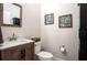 Simple bathroom with a wood vanity and neutral decor at 2237 Palmetum Loop, Apopka, FL 32712