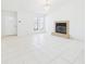 Bright living room featuring tile floors, a fireplace, and a chandelier, providing a cozy and elegant space at 2409 Atrium Cir, Orlando, FL 32808