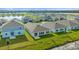 Aerial view of a backyard in a community with lake views and lush greenery at 4939 Worchester Dr, Kissimmee, FL 34746