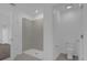 Well-lit bathroom featuring a tiled shower stall and a separate water closet for added privacy at 4939 Worchester Dr, Kissimmee, FL 34746