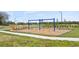 Outdoor playground featuring swings and benches in a community at 4939 Worchester Dr, Kissimmee, FL 34746