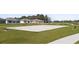 Outdoor sand volleyball court featuring benches on a well-maintained lawn in a community at 4939 Worchester Dr, Kissimmee, FL 34746