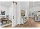 Bright hallway with barn door and view into kitchen and home office at 6979 Big Bend Dr, Saint Cloud, FL 34771