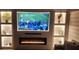Modern living room featuring a built-in electric fireplace and media center at 6979 Big Bend Dr, Saint Cloud, FL 34771