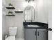 Charming powder room with modern fixtures, floating shelves, decorative herringbone wall, and stylish vanity at 724 Tahiti Dr, Kissimmee, FL 34758