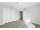 Bright bedroom with luxury vinyl plank flooring and a large double-door closet at 724 Tahiti Dr, Kissimmee, FL 34758