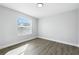 Spare bedroom with natural light, wood floors, and neutral walls at 724 Tahiti Dr, Kissimmee, FL 34758