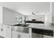 Kitchen featuring granite countertops, modern sink, stainless steel appliances, and sliding glass doors at 724 Tahiti Dr, Kissimmee, FL 34758