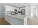 Bright kitchen with granite countertops, stainless steel appliances, and white cabinets at 724 Tahiti Dr, Kissimmee, FL 34758
