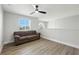 Upstairs living room features luxury vinyl plank flooring and a ceiling fan at 724 Tahiti Dr, Kissimmee, FL 34758