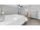 Spacious main bedroom featuring a ceiling fan, walk-in closet, and ensuite bathroom entrance at 724 Tahiti Dr, Kissimmee, FL 34758
